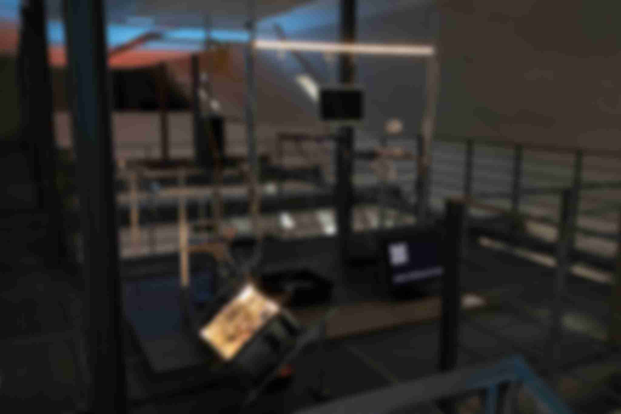 Full view of the /sys/net/visible installation containing multiple opened up computer devices mounted in a aluminium profile construct.