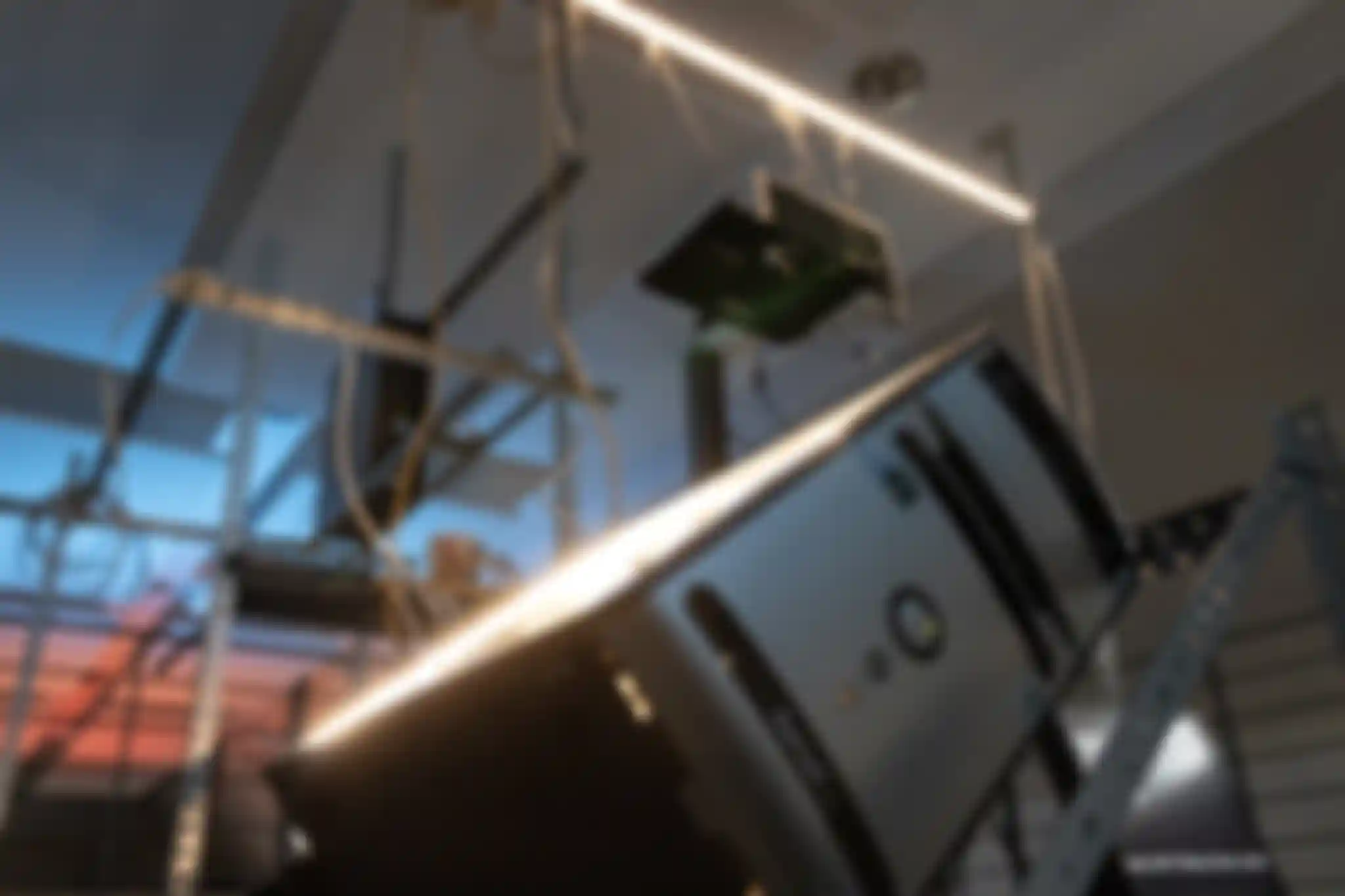 A picture taken from the bottom to the top of the /sys/net/visible installation. It shows a desktop PC close up with the rest of the installation in the background.