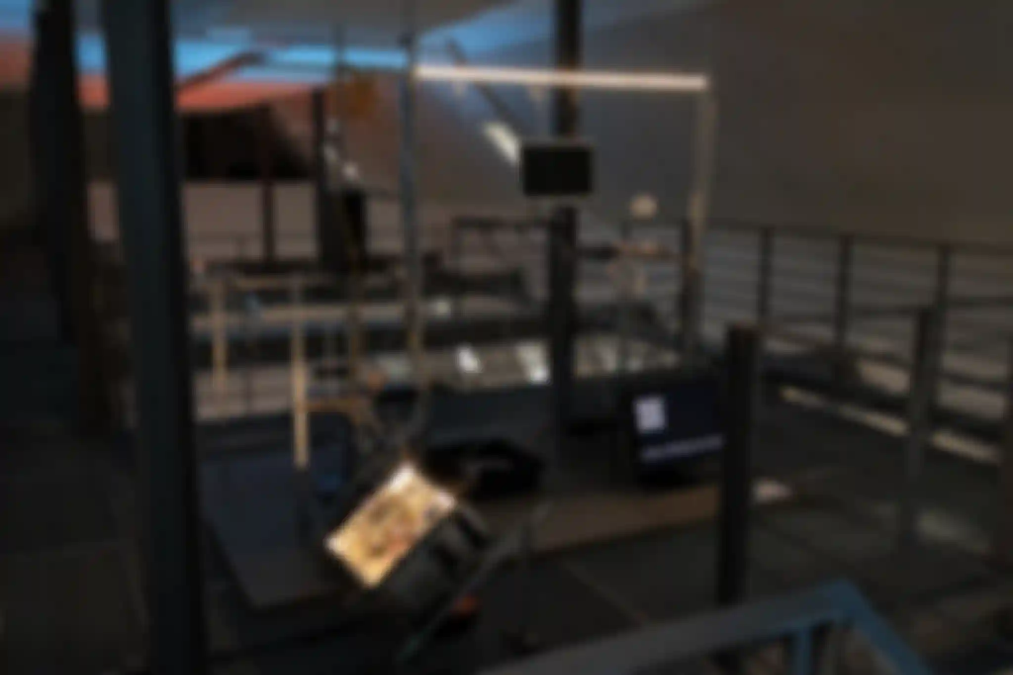 Full view of the /sys/net/visible installation containing multiple opened up computer devices mounted in a aluminium profile construct.